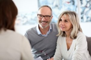 senior couple meeting financial adviser